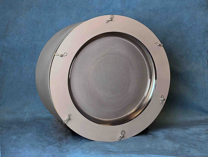 A round cylinder houses the ion beam source and multi aperture grid assembly produces the 23 cm ion beam.