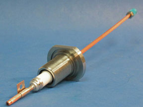 This is an image of a single 32mm RF Feedthrough made of copper tubing, steel, and a ceramic electrical insulator.