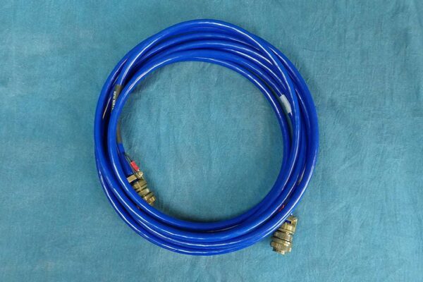 This image is a blue DC cable 18-feet coiled.