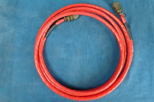 This image is a red DC cable 18-feet coiled.