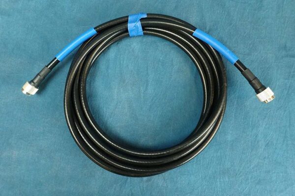 This image is a black RF cable 18-feet coiled.