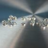 This is an image of 20 tiny hex nuts.