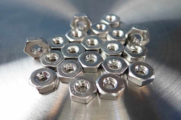 This is an image of 20 stainless steel hex nuts with 6-32 thread.