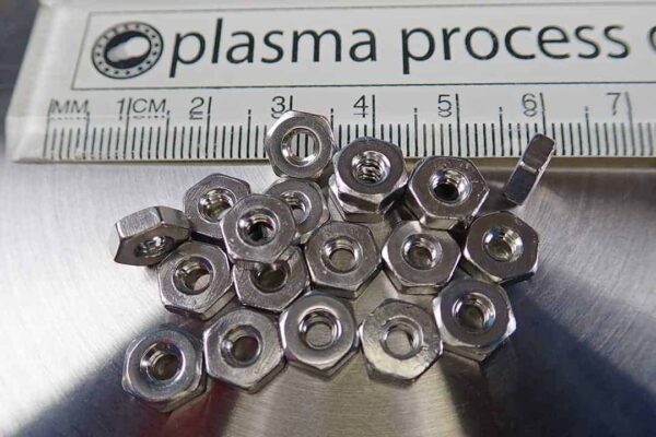 This is an image of 20 stainless steel hex nuts with 6-32 grain.